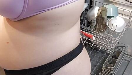 Housewife doing the dishes in her underwear