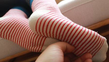 Female doctor's cute cotton socks and bare feet tickling