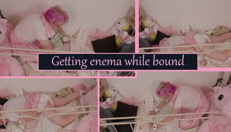 Getting enema and messing my diaper while bound to my crib