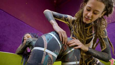 Tattooed hotties fuck each other with crazy toys