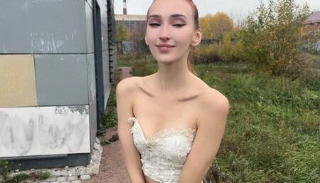 The girl poses with her shoulders in front of the camera