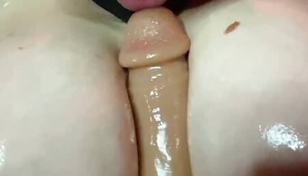 Bigbreasted nymphomaniac rides her big ass on a huge dildo