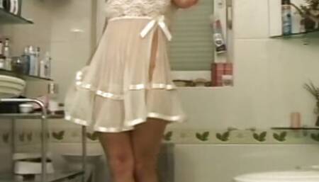 Big boobed lesbian blondes sharing dildos in bathroom