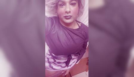 Crossdresser masturbates on her bed