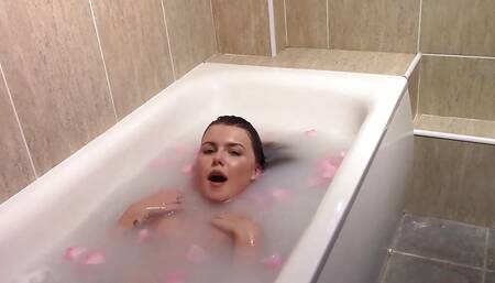 Naked babe photographed in the bath.