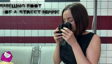 Smelling foot of a street hippie HD