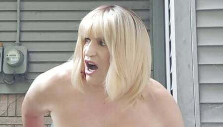 Outside on the patio, taking a dildo up the ass!