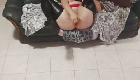 In black latex with black dildo