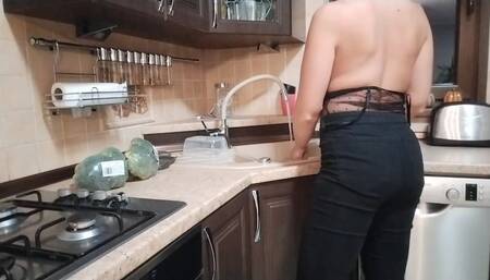 tits in the kitchen by the sink