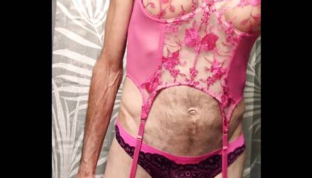 Crossdresser sucking on a dildo teasing ass while wearing sexy pink Lingerie