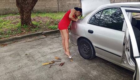 Roxan scratching his feet while repairing his car (3)