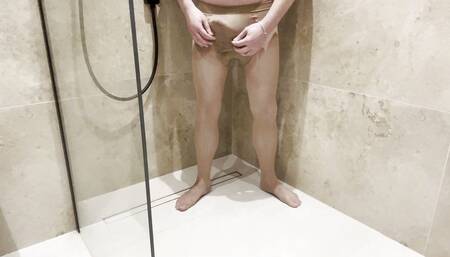 Masturbation with tights in the shower at the hotel