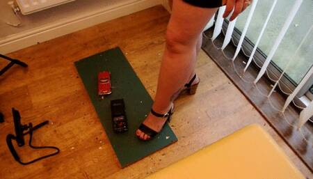 Giantess Lou crushes two old model cars Chevy corvette & Chevy Malibu in big heels extra high right view