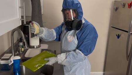 HAZMAT HOUSEWIFE CLEANS UP