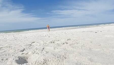 Crossdresser wearing blue tie side bikini at public beach