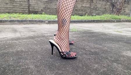 With high heels and fishnet stockings modeling pronounced bows (3)