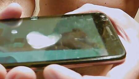 Earl masturbates on his own video and cums on his smartphone display