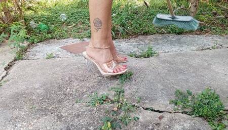 Scratching my feet while cleaning my backyard in high heels (3)