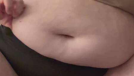 Trying to get old shorts over my stuffed belly