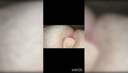 Jerking off with a huge butt plug in