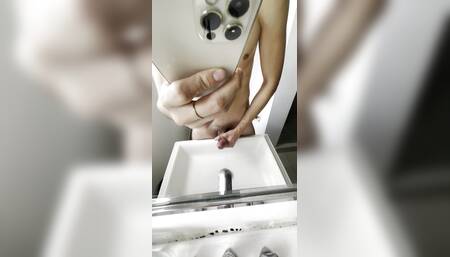 Young Latino masturbates in front of his bathroom mirror and cums
