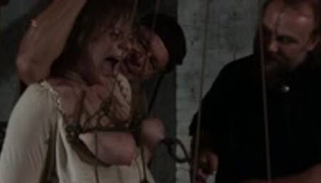 Laura – Medieval punishment for the slutty maids hairy cunt and hanging tits with rough ropes and heavy squeezing iron clamps
