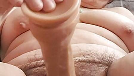 Hot stepmom sticks her dildo in her pussy fucking hard