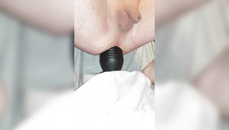 Riding on huge dildo.
