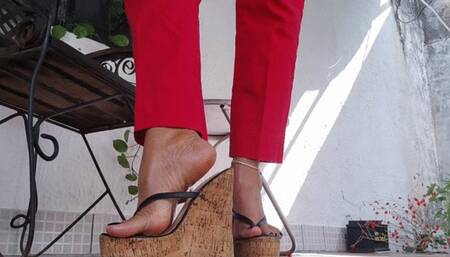 High platform heels dangle from Angelin's oiled feet (1)