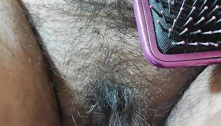 Bbw mom with hairy pussy is combed with a brush
