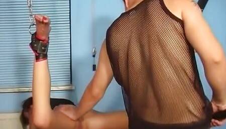 Suspended German bitch sucks dick of her master