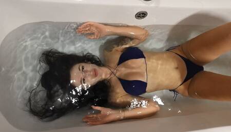 Jade plays with her hair and holds her breath underwater