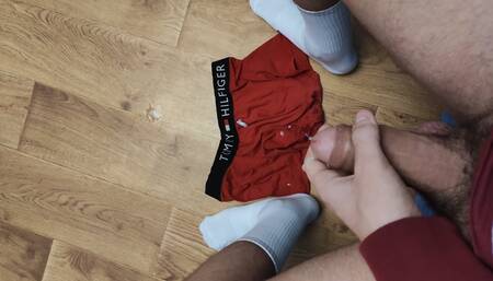 Russian guy jerking off his thick cock and cuming on underpants