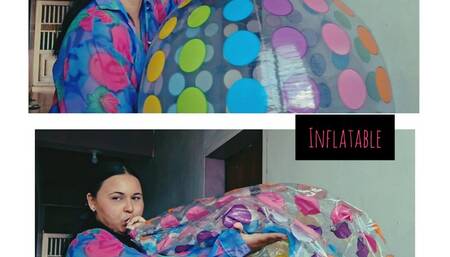 Naomi inflates very fast a big ball and fills it with kisses and caresses, inflatable