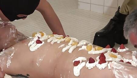 Female Body Cake. Mistress Spreads Cream on Female Slave's Body and Makes Her Lick Her Whole Body as Food for Male Slaves