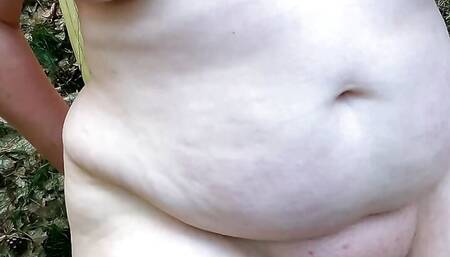 Complete naked in the woods - beating her vagina and tits