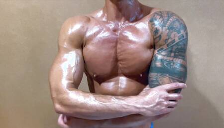 Worship this hot oiled up Asian muscle hunk as he show off his big pecs and play with his nipples