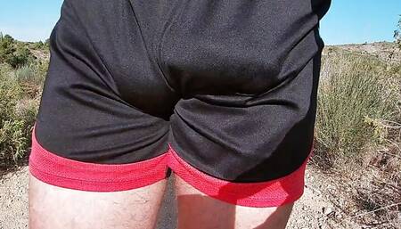 Hiking horny in shiny short shorts