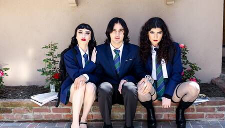 Two goth chicks share a friend's cock on the Halloween