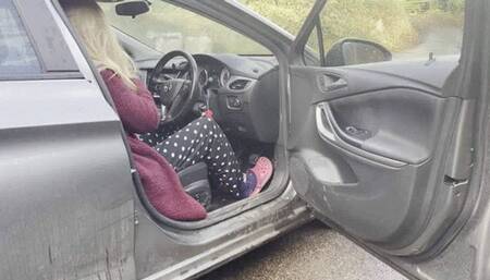 Jess revving and warming up the car with pink crocks