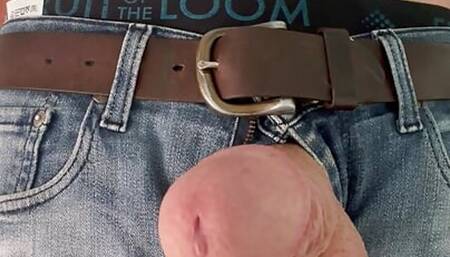 Stiff prick in jeans is leaking and wants to be sucked