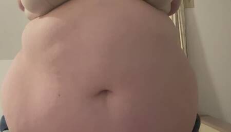 Trying on an old t-shirt with my fat belly