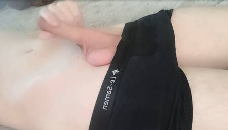 The guy jerks off his dick in his underpants and gets pleasure
