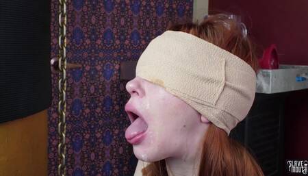 Blindfolded redhead slavegirl gagging cock