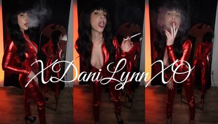 Smoking Wearing Shiny Red Catsuit