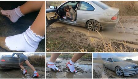 Real estate agent for her powerful BMW stuck in deep mud