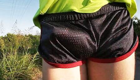Tight shiny sport shorts bulging routine (freeballing in a public place)