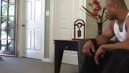 A blonde girl having huge fake breasts getting pounded by a big black stud