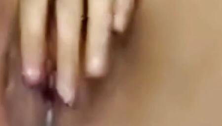 This Asian girl keeps playing with her pussy until she squirts