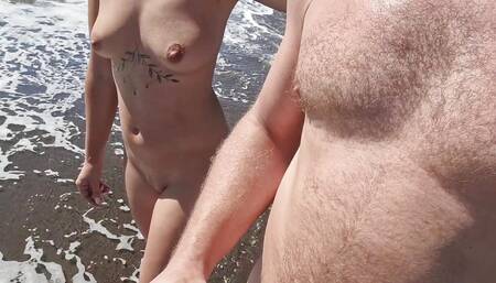 stepfather and stepdaughter walk naked on the beach